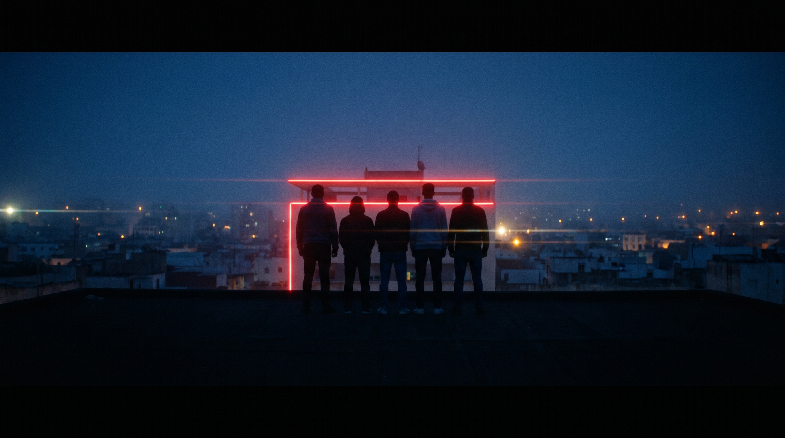 Five members of the Elyra team standing on a Rabat rooftop at blue hour