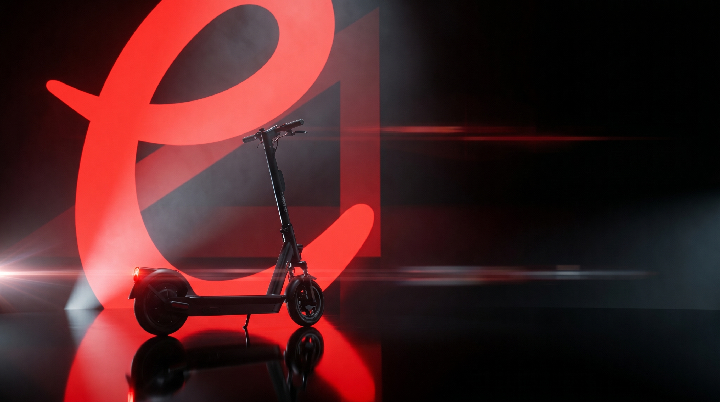 Long-exposure photograph of an Elyra scooter with red and white light trails.